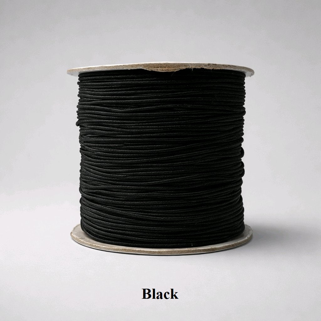 1mm black nylon-covered elastic thread. This professional, matte-finish cord is the industry standard for "lava stone" bracelets and dark-themed jewelry