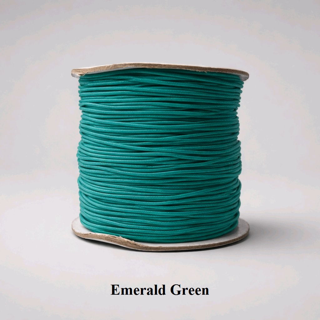 Deep emerald green 1mm nylon-covered elastic., jewel-toned thread designed to blend seamlessly with dark gemstones and elegant glass beads
