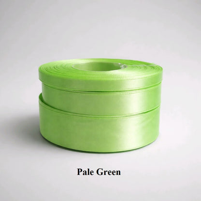 6mm pale green satin ribbon; soft pastel green 32m reel for spring crafts and delicate papercraft.