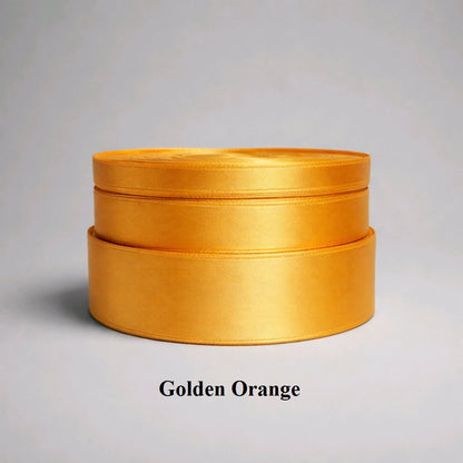 A rich dark yellow/amber shade of 25mm satin silky ribbon perfect for harvest-themed decor and autumn weddings.