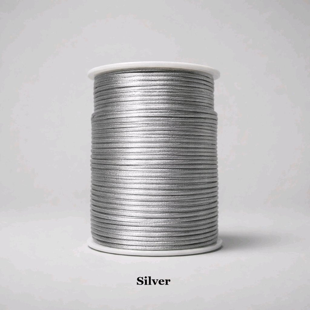 2mm silver rattail cord; cool metallic-grey silky nylon thread for contemporary jewellery and shimmering gift wraps.