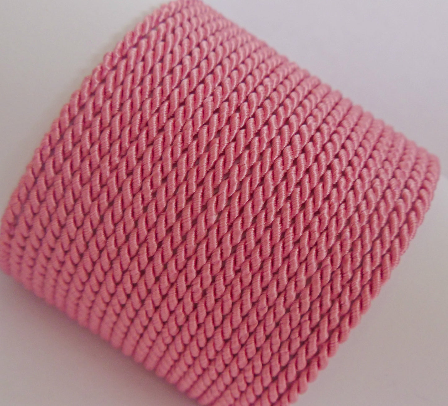 2mm pink twisted cord; vibrant rose-colored braided rope for children's room decor, gift bows, and jewelry making