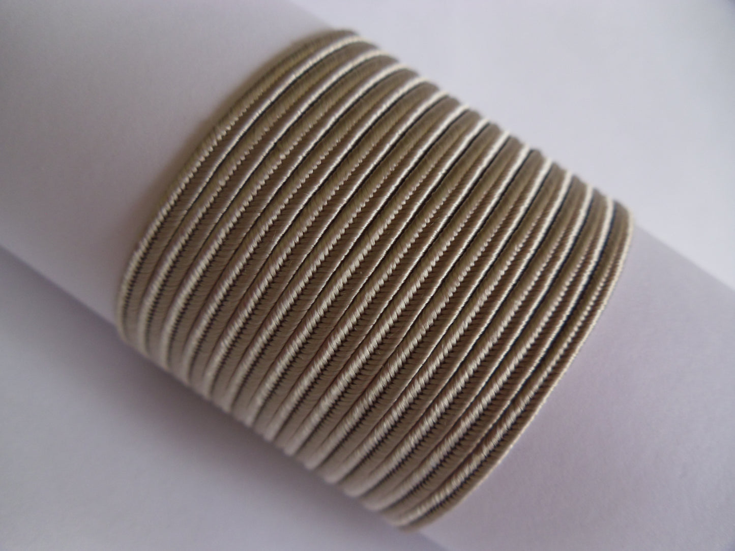 Sand 3mm soutache, ash-toned flexible cord for modern jewellery making and garment detailing