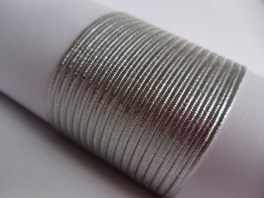 2mm metallic silver soutache braid trim; glossy silver flat cord for military regalia, bridal embroidery, and high-end jewellery making; professional-grade Czech cord with a bright, reflective metallic finish.