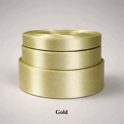 6mm classic gold single-sided satin ribbon; 32m of lustrous trim for luxury packaging and festive holiday decor.