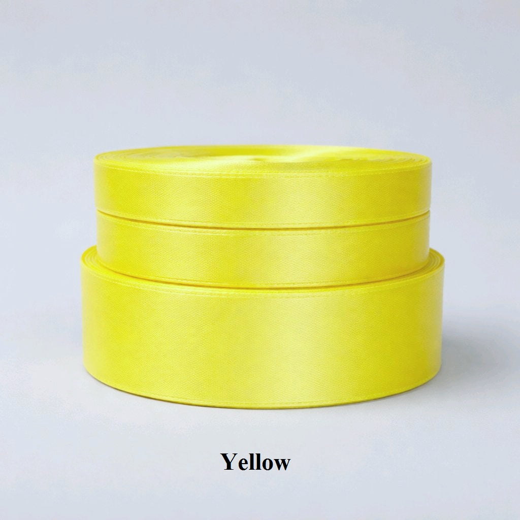 6mm bright yellow single-sided satin ribbon; vibrant 32m reel for cheerful gift wrapping and children's crafts. 